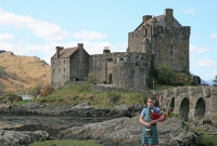 Eilean Donan Castle, Scotland with Bagpiper
